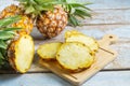 Fresh pineapple fruit sliced Ã¢â¬â¹Ã¢â¬â¹on a wooden cutting board Royalty Free Stock Photo